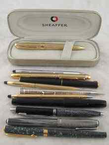 Appraisal: A Sheaffer ballpoint gold plated in case together with three