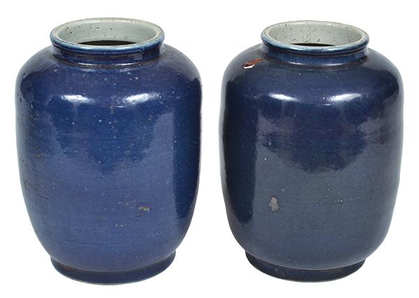 Appraisal: TWO CHINESE BLUE GLAZED EARTHENWARE JARS the tallest cm high