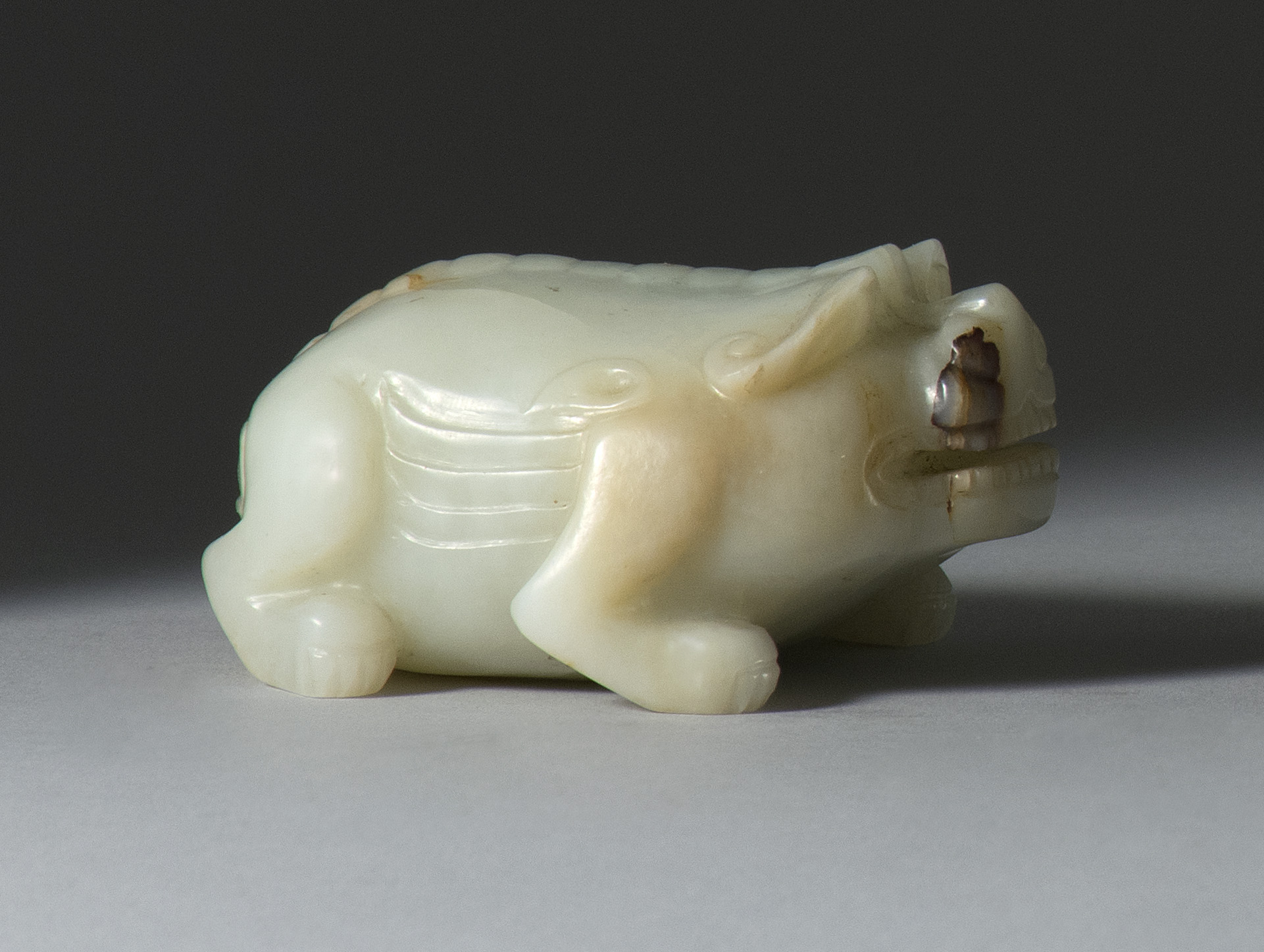 Appraisal: WHITE AND RUSSET JADE CARVING th CenturyIn the form of