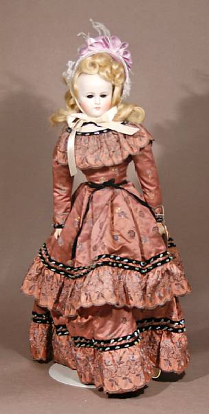 Appraisal: A German bisque turn head doll the dome-head doll with