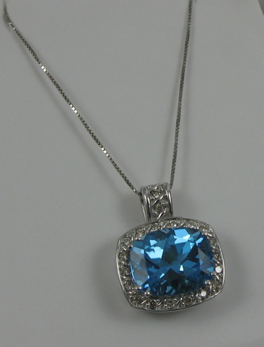 Appraisal: BLUE TOPAZ AND FOURTEEN KARAT GOLD PENDANT NECKLACE with appraisal