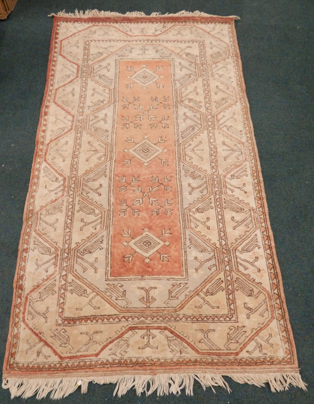 Appraisal: A modern Persian type rug with a design of medallions