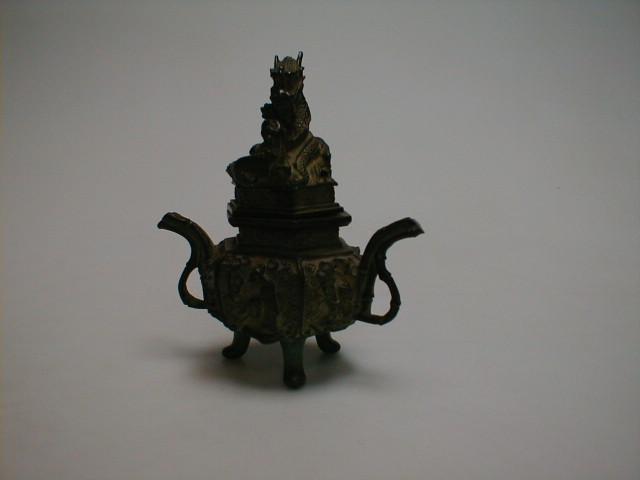 Appraisal: A Chinese bronze koro the cover decorated with a raised