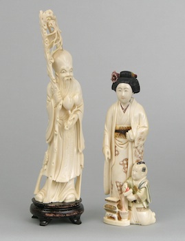 Appraisal: A Pair of Carved Ivory Figures Containing a carved ivory