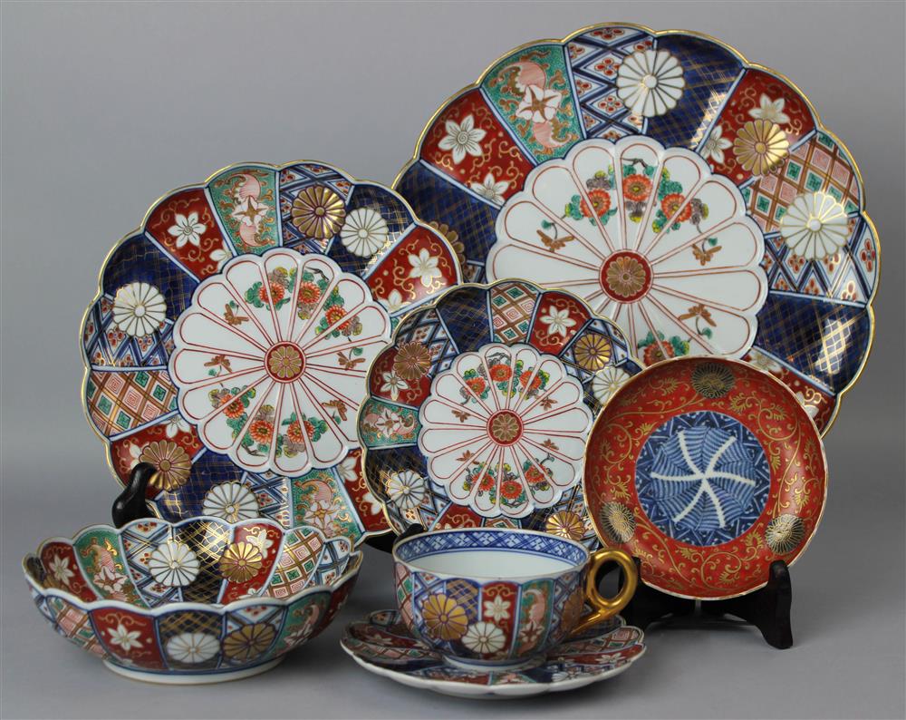 Appraisal: A JAPANESE IMARI PART DINNER SERVICE BEARING -CHARACTER UNDERGLAZE BLUE