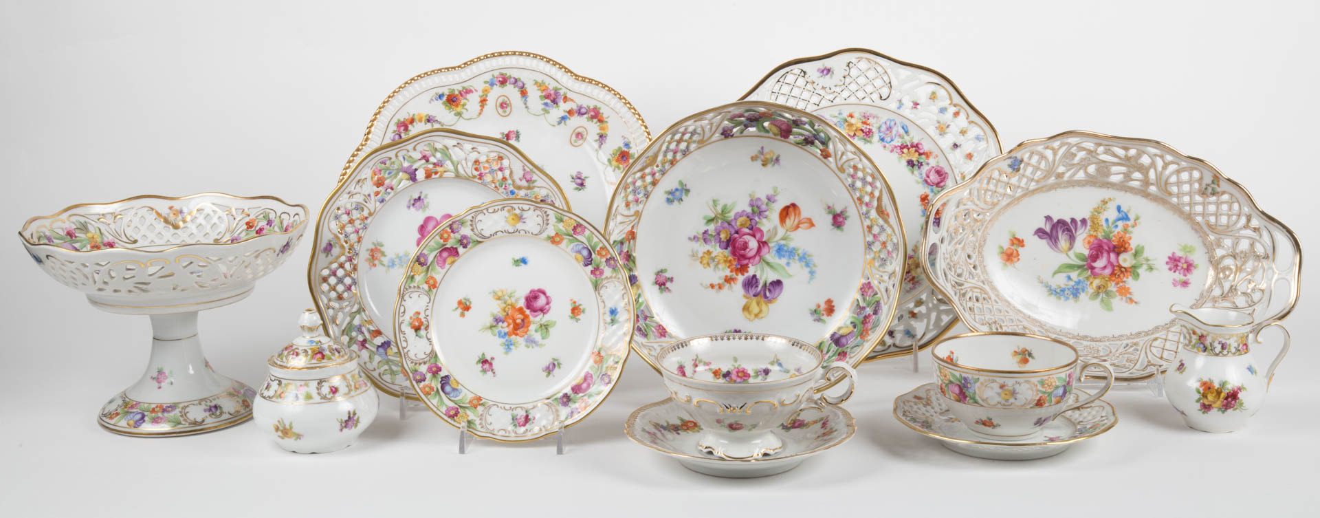 Appraisal: Schumann porcelain partial dinner service approx pieces comprising compote serving