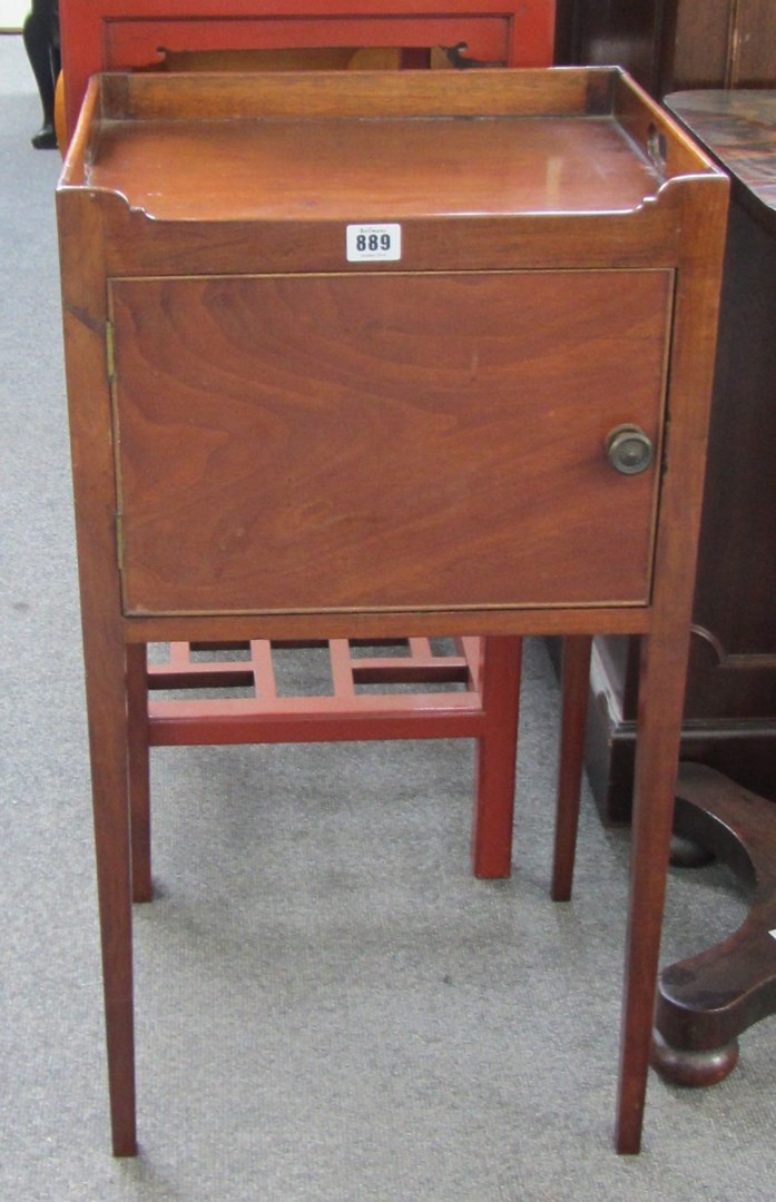 Appraisal: An early th century mahogany night stand the galleried top