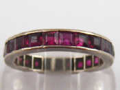 Appraisal: A white metal test carat gold ruby full eternity ring