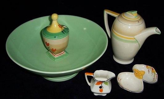 Appraisal: A Clarice Cliff jam pot and cover decorated tulips cm