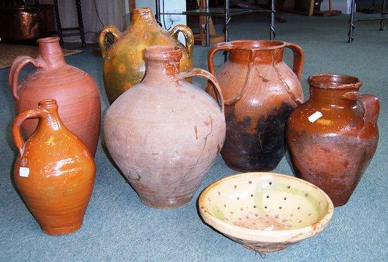 Appraisal: Six Spanish terracotta pots and a colander