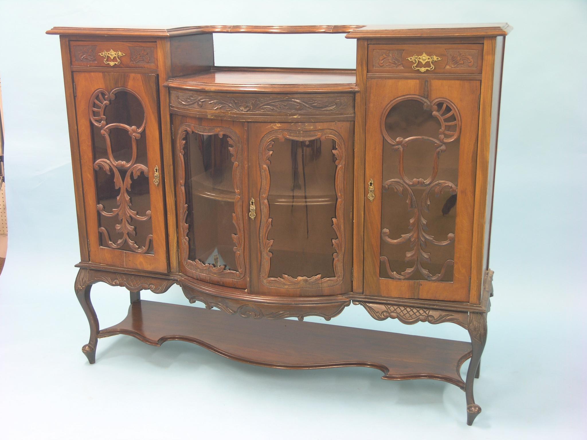 Appraisal: A late Victorian walnut chiffonier two pairs of glazed doors