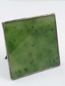 Appraisal: A Russian silver easel frame mounted nephrite panel cm square