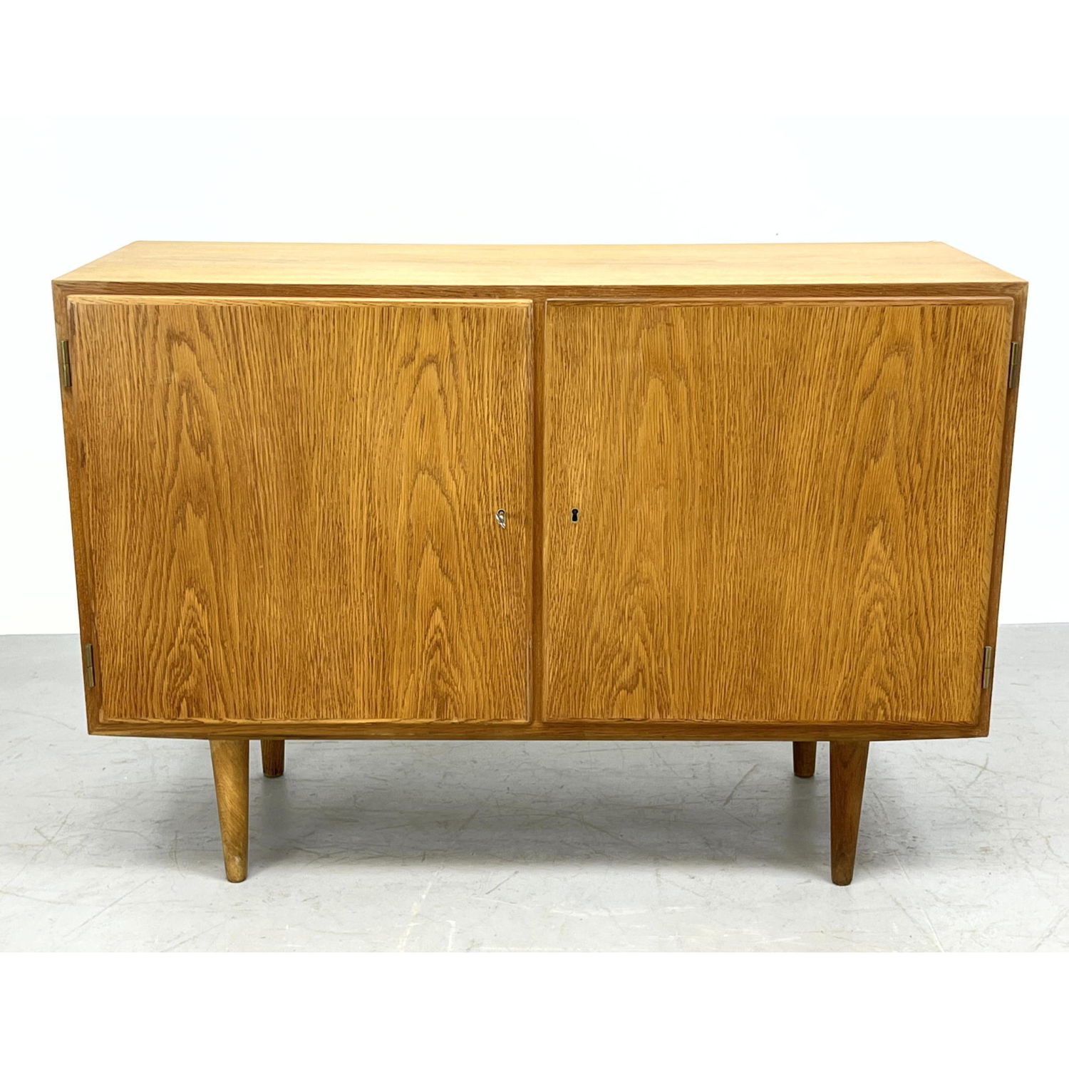 Appraisal: DANISH Modern door oak cabinet up on peg legs Dimensions