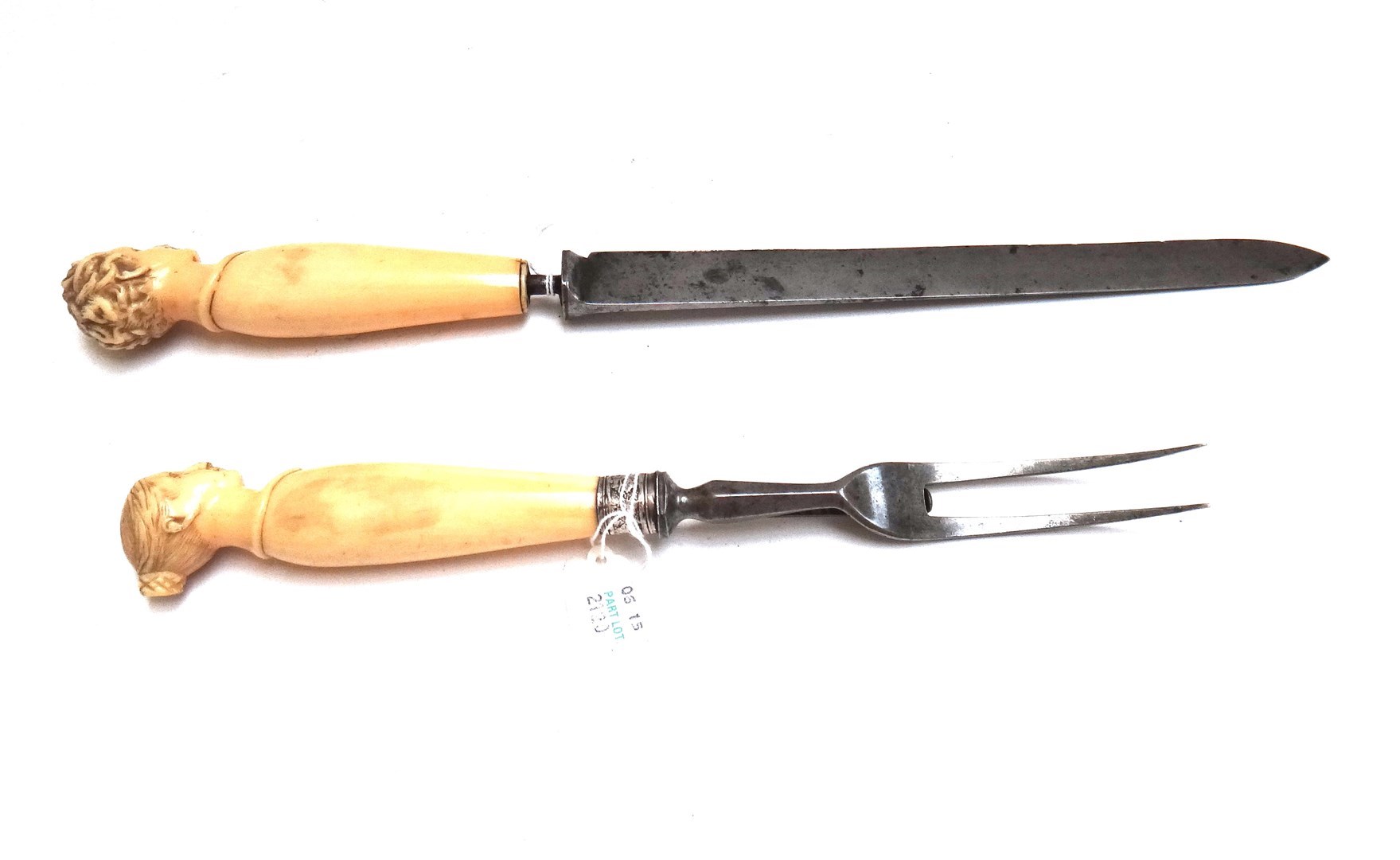 Appraisal: A Victorian steel and ivory mounted carving set the handles