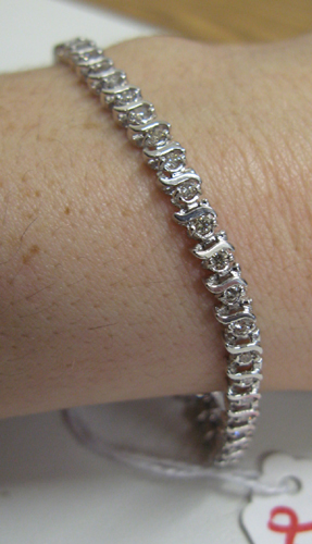 Appraisal: DIAMOND AND FOURTEEN KARAT WHITE GOLD BRACELET inches in length