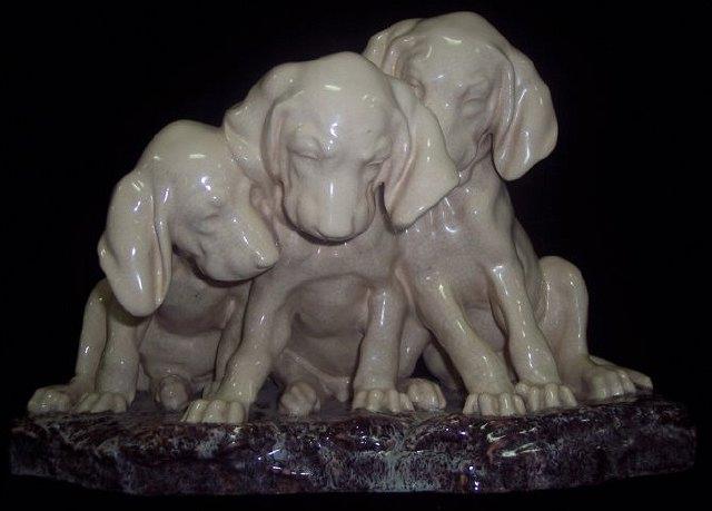 Appraisal: A group of three puppies by Georges Lucien Vacossin signed