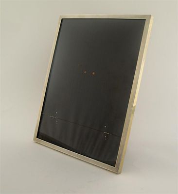 Appraisal: An art deco oblong photograph frame with a reeded silvergilt