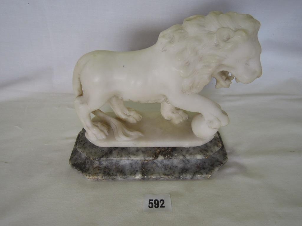 Appraisal: A marble carving of a male lion with its front