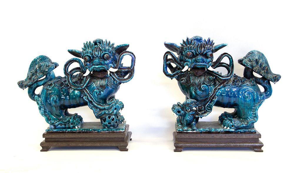 Appraisal: A Pair of Blue Flambe Glaze Foo Dogs Chinese A