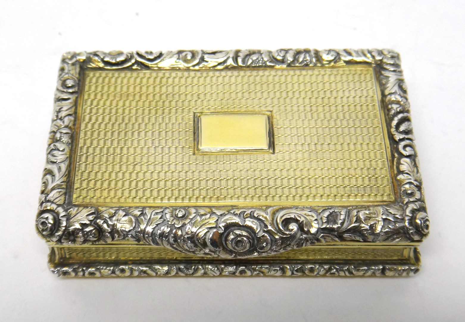 Appraisal: A silver gilt rectangular hinge lidded snuff box gilt within