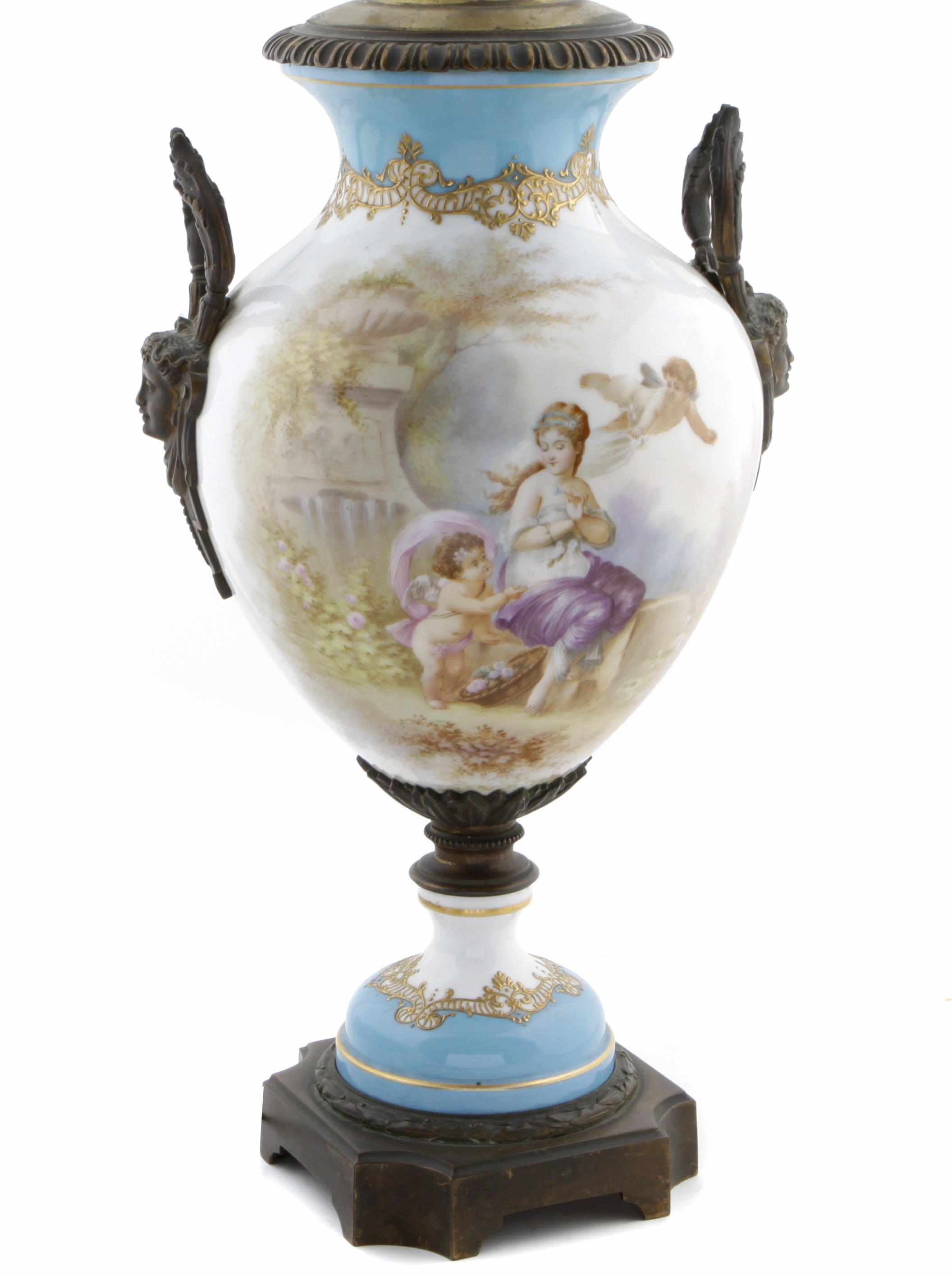 Appraisal: A Svres style bronze mounted porcelain urn mounted as a