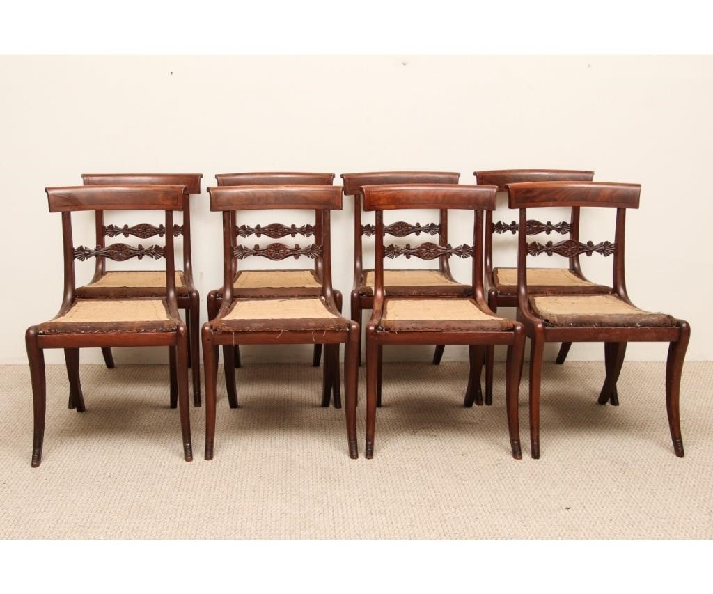 Appraisal: Set of eight classical mahogany sabre leg side chairs circa