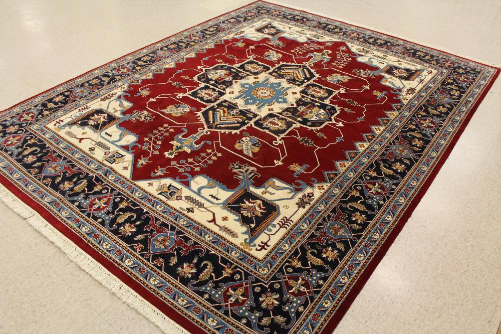 Appraisal: HAND KNOTTED ORIENTAL CARPET Pakistani-Persian traditional Heriz design with large