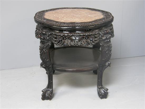 Appraisal: Chinese carved rosewood two tier table with pink marble inset