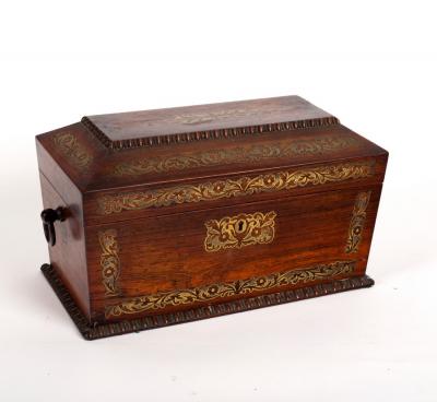 Appraisal: A Regency rosewood tea caddy of sarcophagus shape inlaid brass