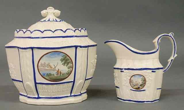 Appraisal: Hard paste sugar bowl x and creamer with Chinese landscape