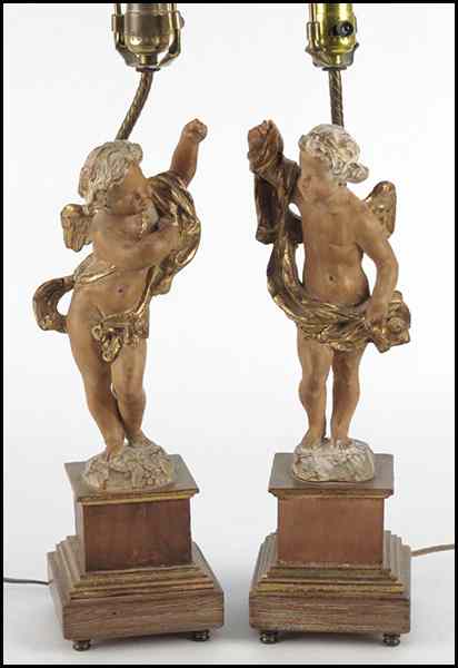 Appraisal: PAIR OF PARCEL GILT CARVED FRUITWOOD CHERUB TABLE LAMPS Cherub