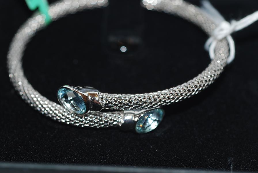 Appraisal: A SILVER MESH BANGLE SET WITH BLUE STONES A SILVER