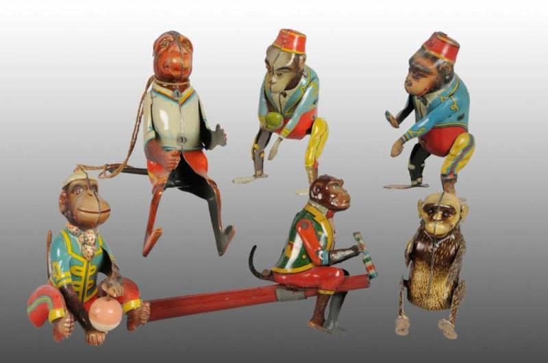 Appraisal: Lot of Tin Monkey Wind-Up Blow Toys Description German Working