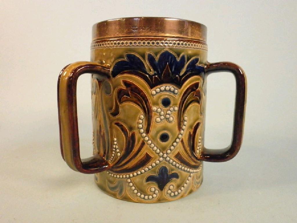 Appraisal: A Doulton Lambeth tyg with incised decoration of flowers and