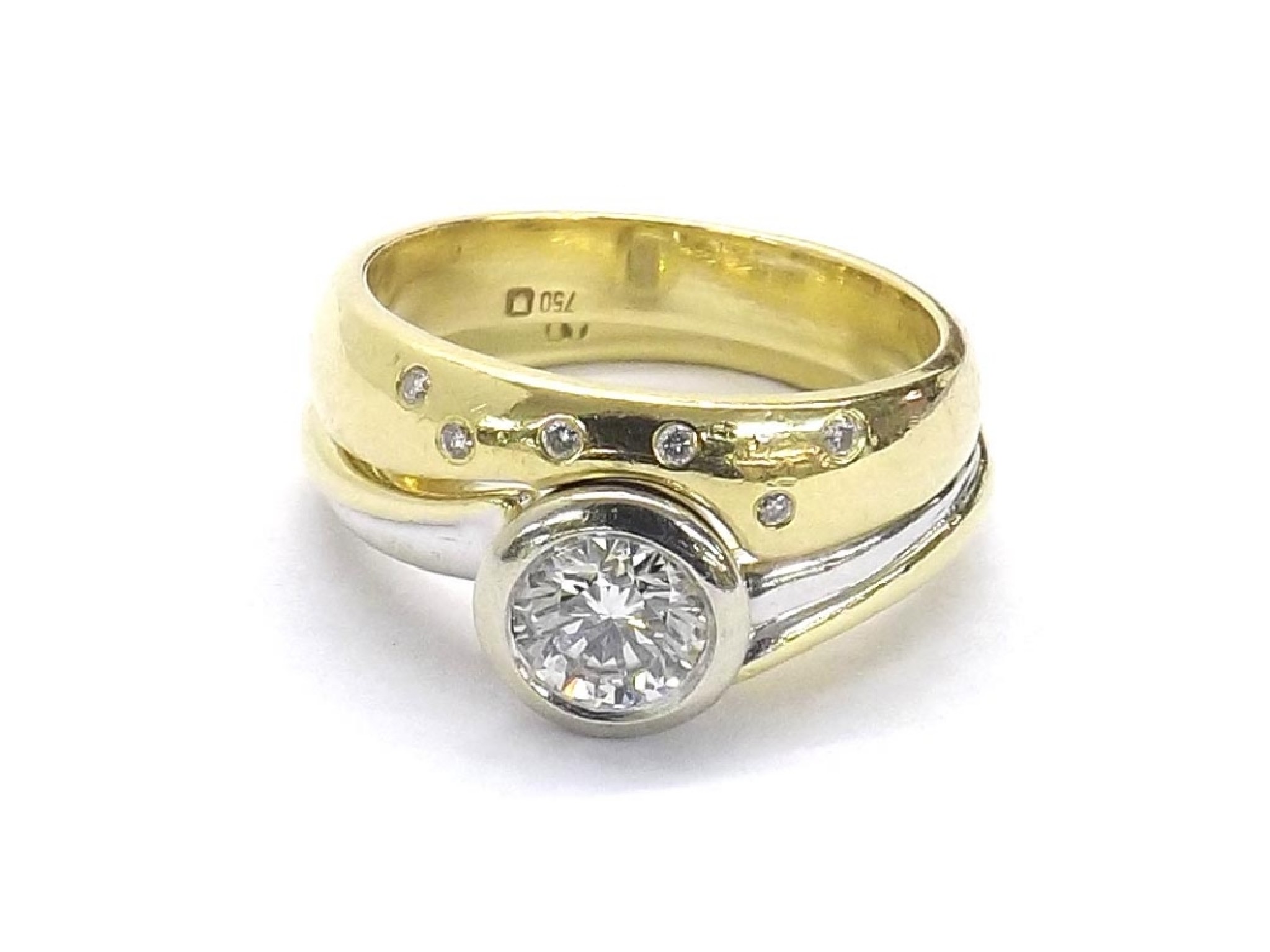 Appraisal: - -A ct diamond solitaire ring with fitted diamond wedding