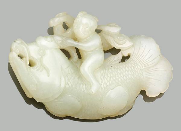 Appraisal: A miniature jade carving of a carp and child The