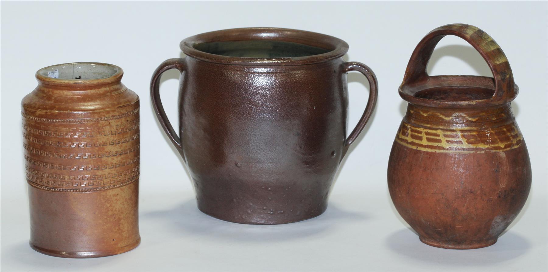 Appraisal: THREE PIECES OF REDWARE Two southern pieces including a two-handled