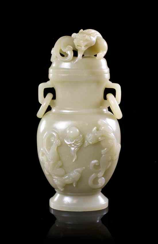 Appraisal: A Chinese Lidded Jade Vase of opaque cream colored stone