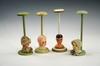 Appraisal: DOLL HAT STANDS - Lot of four - figural base