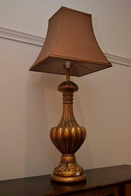 Appraisal: A CLASSICAL STYLE GILT LAMP BASE WITH SHADE