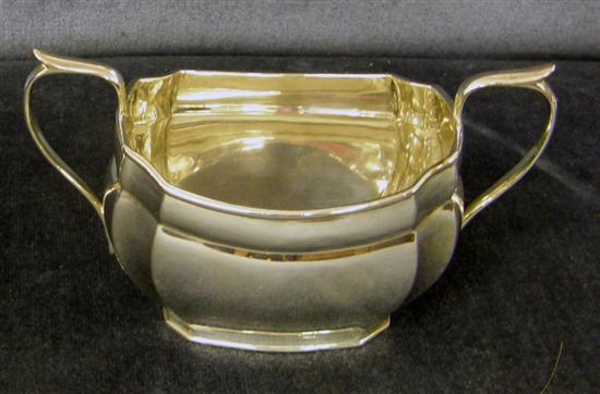 Appraisal: A PLAIN SHAPED OBLONG SILVER TEAPOT and a matching sugar