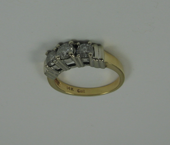 Appraisal: DIAMOND AND K YELLOW AND WHITE GOLD RING set with