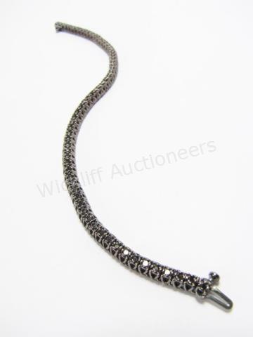 Appraisal: A black rhodium sterling silver black diamond tennis bracelet long