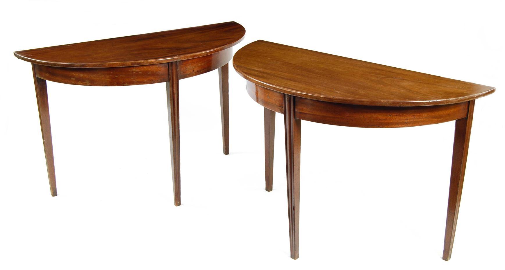 Appraisal: A pair of mahogany demi-lune console tables