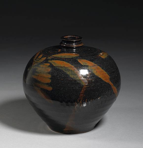 Appraisal: A Cizhou type black glazed stoneware jar with russet decoration