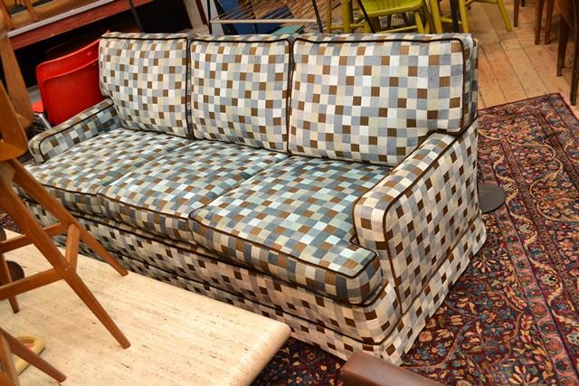 Appraisal: A THREE SEAT SOFA IN BLUE AND GREY CHECKERED UPHOLSTERY