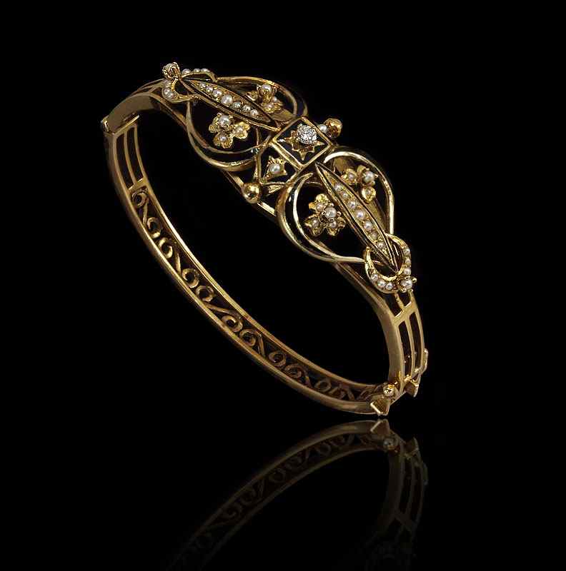 Appraisal: ENAMELED K DIAMOND SEED PEARL BANGLE BRACELET K yellow gold