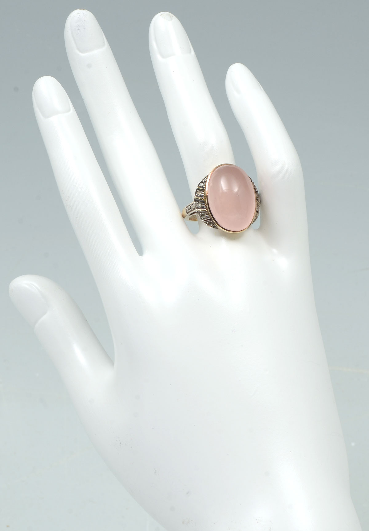 Appraisal: K ROSE QUARTZ CABOCHON DIAMOND RING K yellow gold ring