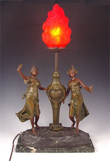 Appraisal: DECO ERA BRONZED FIGURAL LAMP WITH RED FLAME SHADE Form