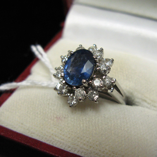 Appraisal: BLUE SAPPHIRE DIAMOND AND FOURTEEN KARAT WHITE GOLD RING with